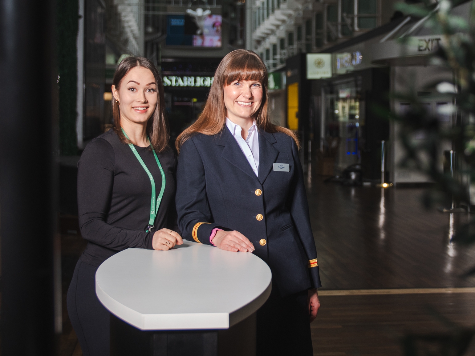 Two women smile and look into the camera. Tallink Silja's ship nurse Terhi Vuori and Mehiläinen's nutritionist Johanna Räsänen.